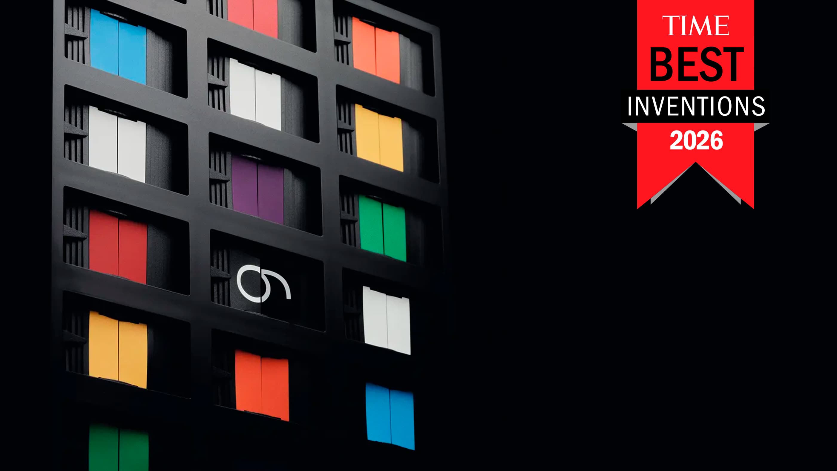 Close-up of Vestaboard Note's colorful flaps beside the red TIME Best Inventions 2026 badge