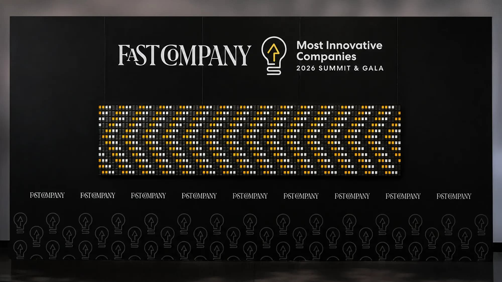 24-Note Vestaboard Note Array under the Fast Company Most Innovative Companies 2026 Summit & Gala sign