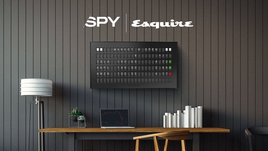 Spy Esquire logos above Vestaboard showing stock portfolio channel from Vestaboard+