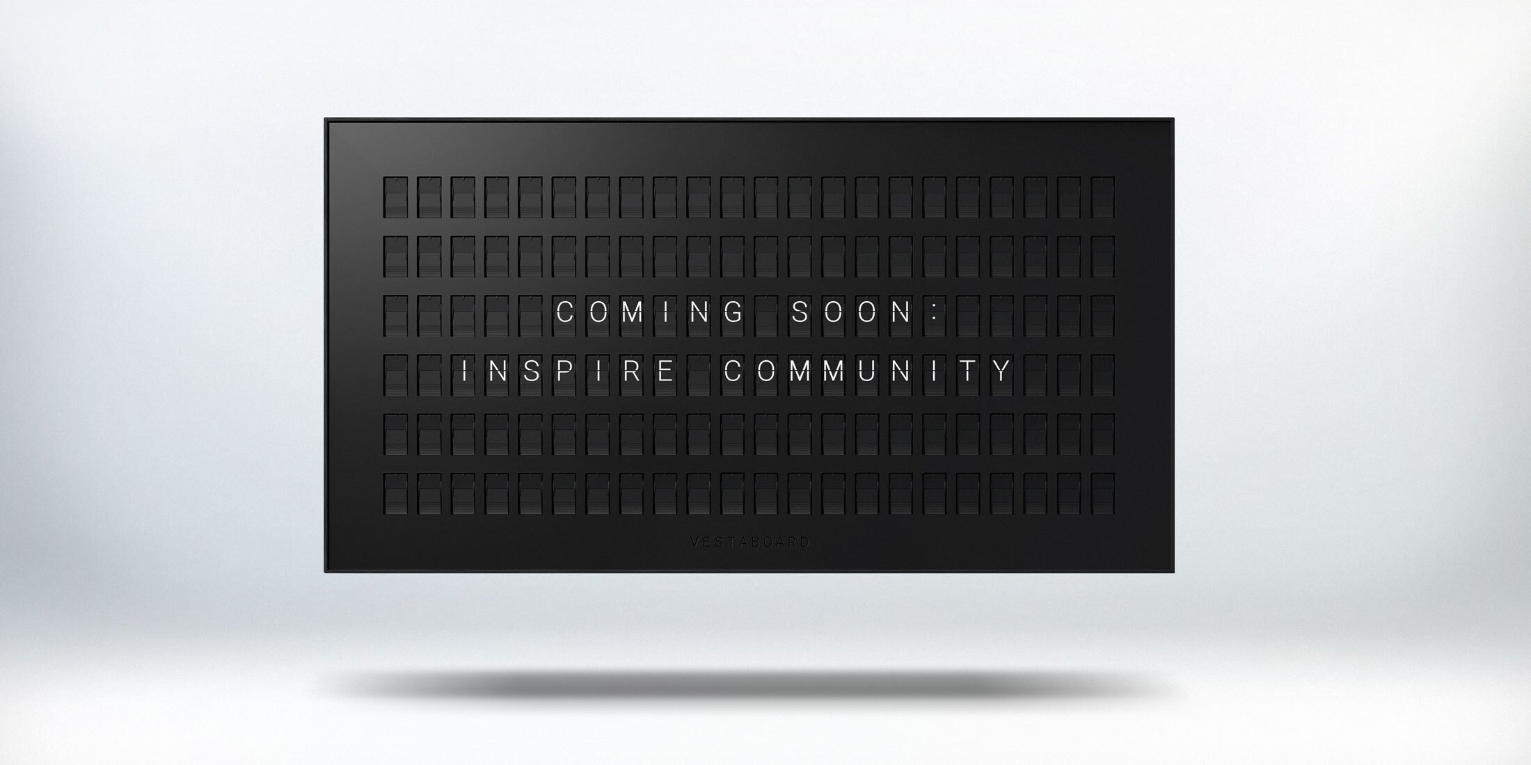 Vestaboard shows Coming Soon: Inspire Community